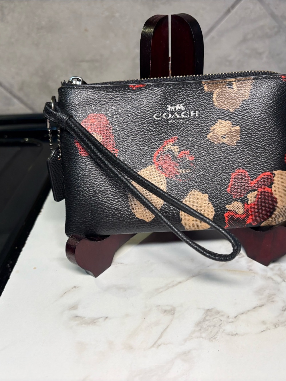 COACH Black Floral Print Wristlet with Red & Tan Accents